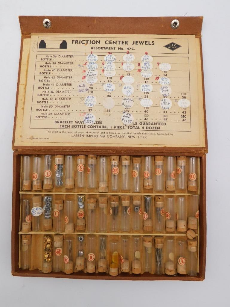 Vintage Larsen Watchmaker Friction Center Jewel Assortment No. 47C: A vintage watchmaker's parts assortment box titled 'Friction Center Jewels, Assortment No. 47C,' an L.I.C. product compiled by Larsen Importing Company of New York. The hinged case holds roughly 48
