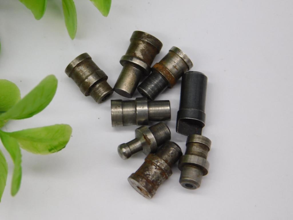 Lot of Watchmaker Staking Set Punches (9 pcs): Nine assorted watchmaker staking set punches and dies, mostly steel with light surface rust, including one black-finished punch with an angled tip. Used with a staking tool for watch case and jewel