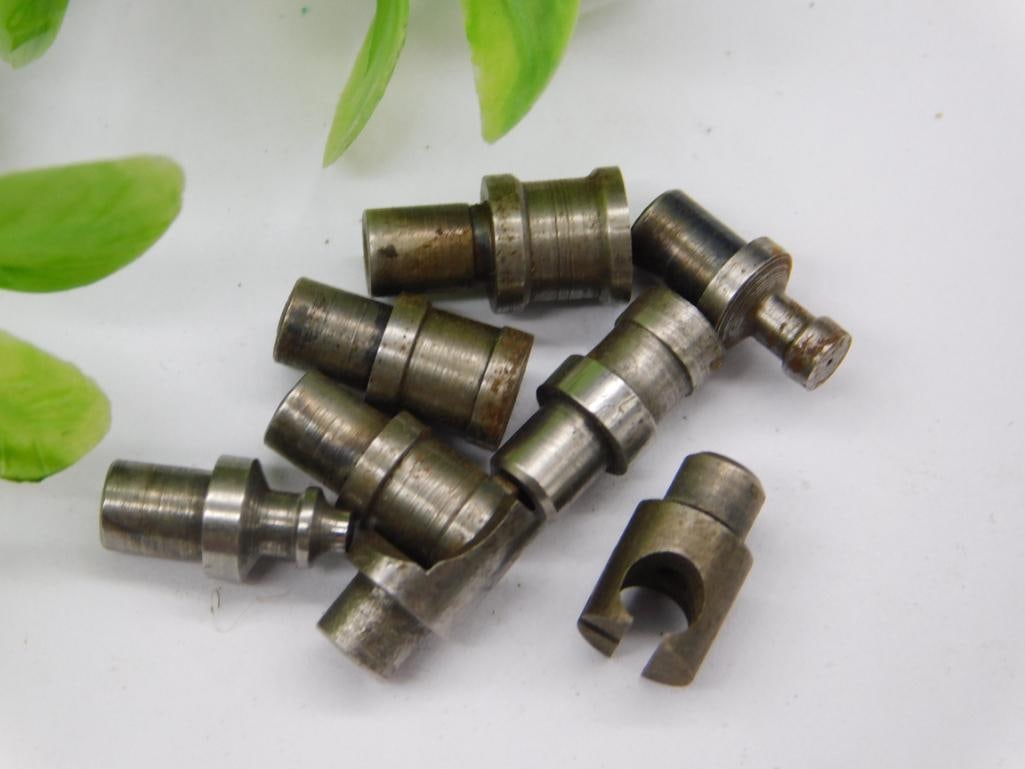 Watchmaker Staking Punches with Open Collet Die (8 pcs): Eight watchmaker staking set punches and dies, including one open, semi-circular notched collet die, in worn steel finish with light rust. Used for watch case and movement work. See photos for exact