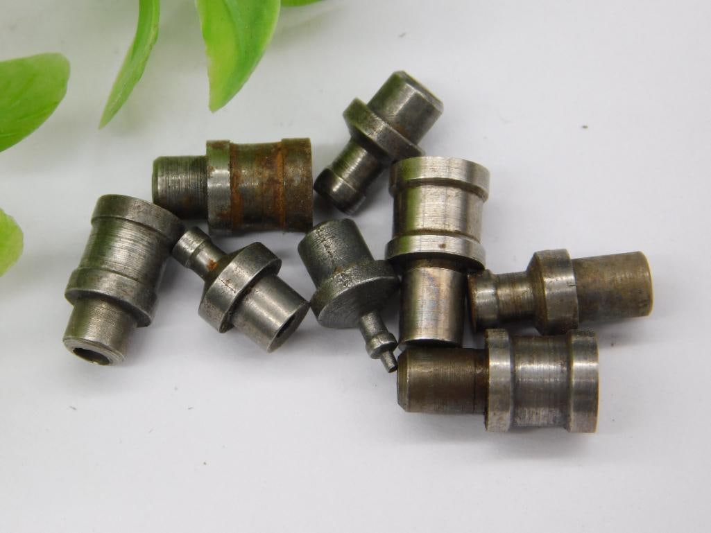 Lot of Watchmaker Staking Set Punches (9 pcs): Nine assorted watchmaker staking set punches and dies in mixed steel finishes, some with light surface rust, featuring a variety of pointed and stepped tips. Used with a staking tool for watch case