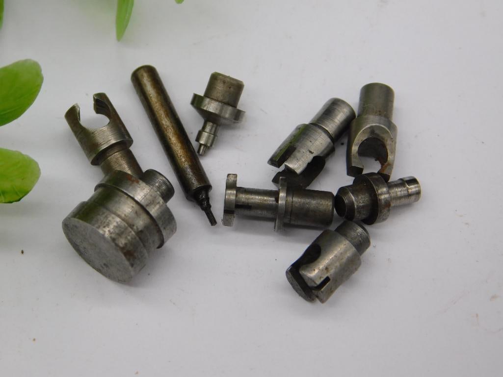 Watchmaker Staking Punches with Open Collet Dies (8 pcs): Eight watchmaker staking set punches and dies, including two open C-shaped notched collet dies and a slender knurled punch tool, in mixed steel finish. Used for watch case and movement work. See