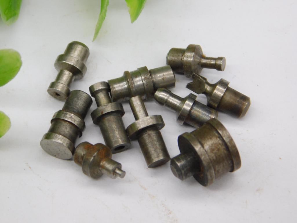 Lot of Watchmaker Staking Set Punches (10 pcs): Ten assorted watchmaker staking set punches and dies, including a notched forked-tip punch and several threaded or grooved shanks, in a worn steel finish. Used with a staking tool for watch case and