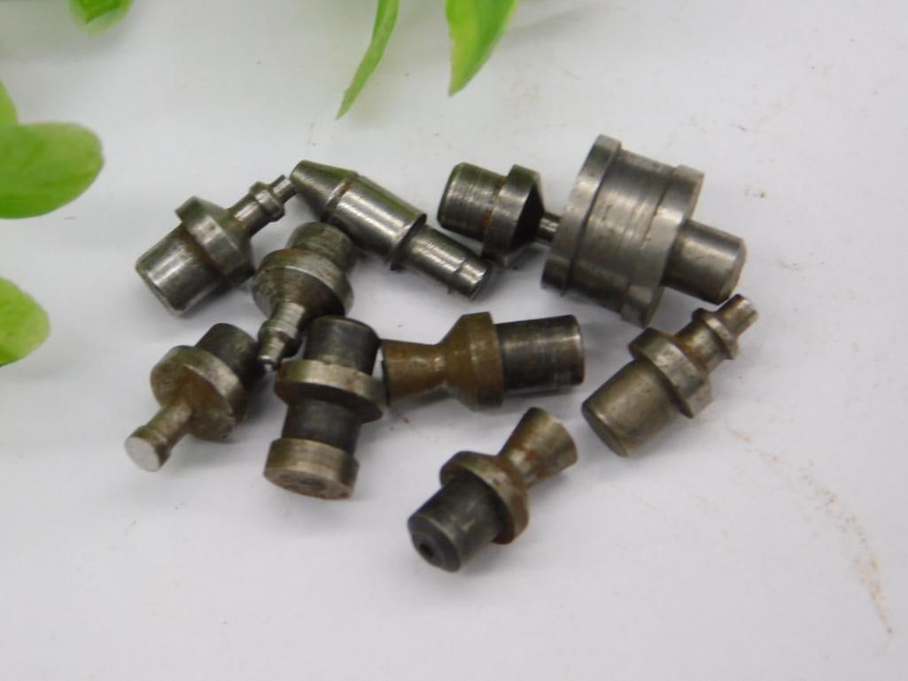 Assorted Watchmaker Staking Set Punches - Mixed Tips: A group of approximately ten unmarked steel watchmaker staking-set punches/stakes in graduated sizes, with tips ranging from flat and domed to conical points and cupped ends. These interchangeable