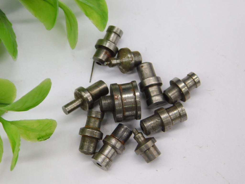 Watchmaker Staking Punches - Assorted Flanged Stems: A group of unmarked steel watchmaker staking-set stakes with flanged stems, pointed tips, and cupped heads in graduated sizes, used with a staking tool for watch repair. See photos for exact size and