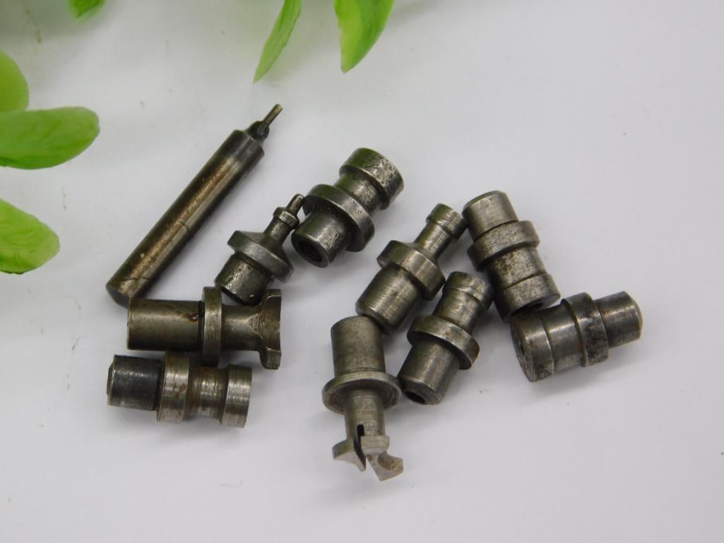 Watchmaker Staking Punches - Cone-Tip Styles: A group of unmarked steel watchmaker staking-set stakes with several cone-shaped and tapered tips along with flanged and flat-topped punches, generally clean steel with minimal rust. See photos for
