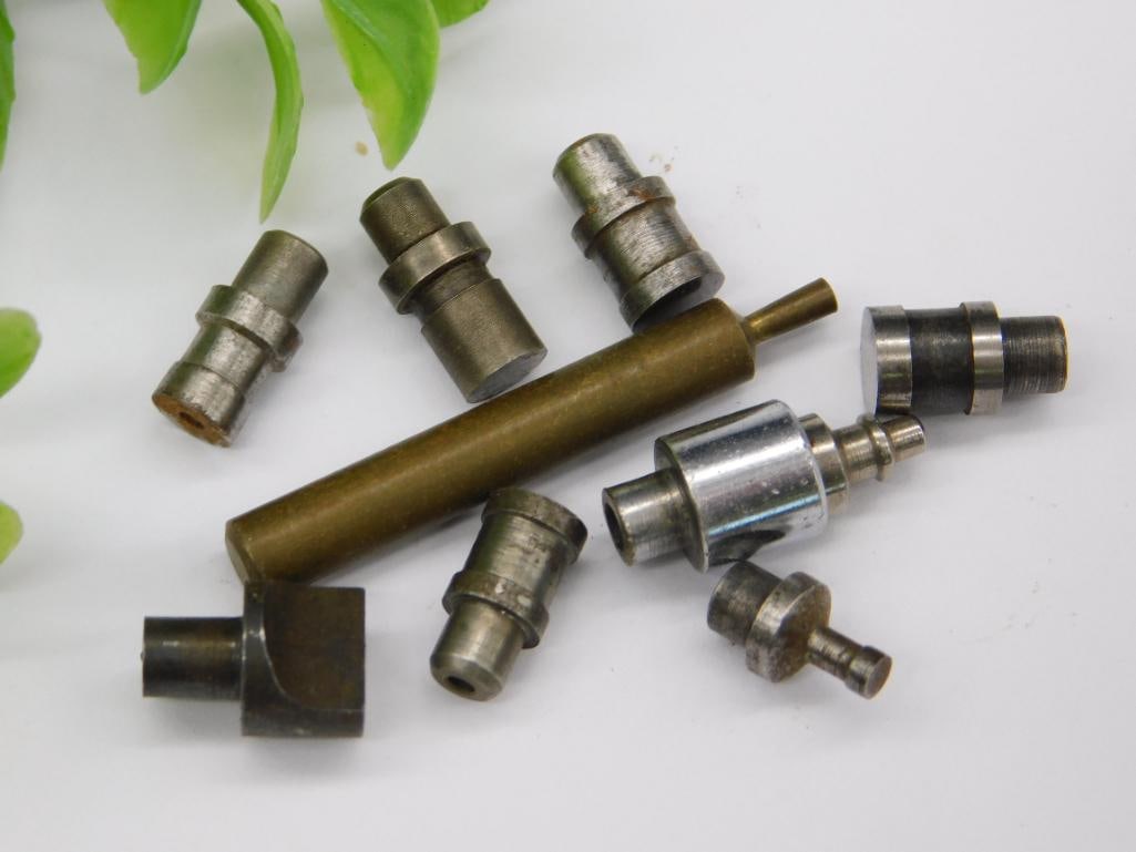 Watchmaker Staking Set incl. Fork Wrench & Thumbscrew: An assorted lot of watchmaker staking-set and repair tool pieces including a forked wrench-style bit with a threaded shaft, a knurled thumbscrew-style cap, a brass-tipped rod, and additional cupped