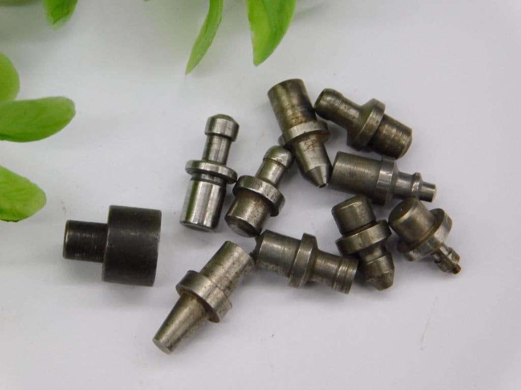Watchmaker Staking Punches incl. Fluted Cross-Bit: Assorted unmarked steel watchmaker staking-set stakes including a fluted, cross-shaped punch tip along with flanged and cupped pieces. See photos for exact size and condition.