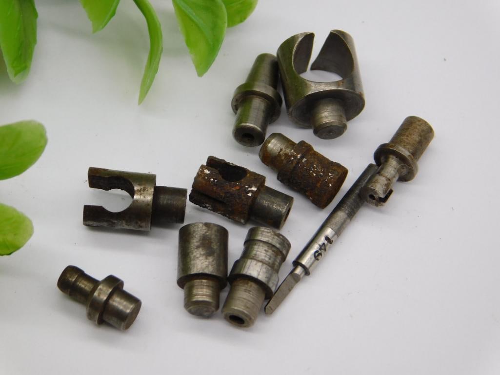 Watchmaker Staking Punches with Forked Tool Ends: Group of small steel components including forked/notched tips and stepped-shaft punches, consistent with watchmaker staking or hand-pulling tools. Unmarked, with light rust on some pieces.