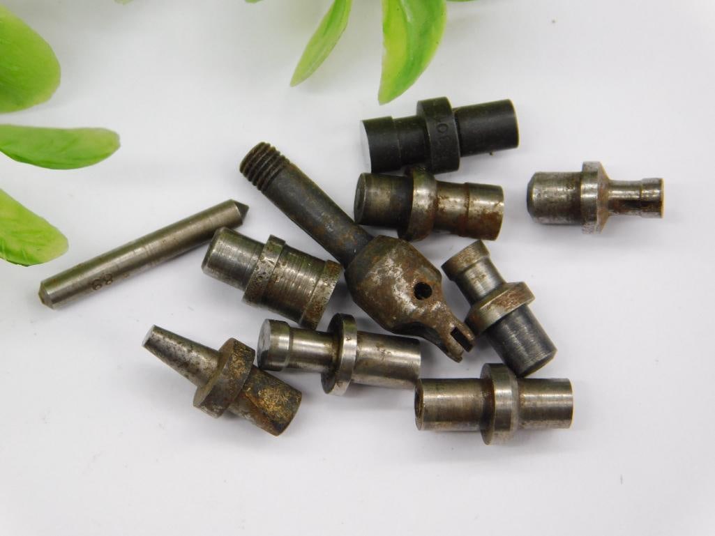 Watchmaker Staking Tool Parts with Threaded Fork Piece: Group of small machined steel parts including a threaded forked-end piece and several stepped punches with pointed or cupped tips. Unmarked, with light rust on some components.
