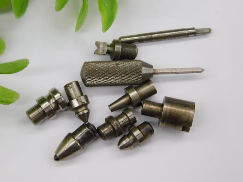 Watchmaker Staking Tool Parts with Brass Piece & Coin: Group of small steel and brass machined parts, with a brass cylindrical fitting, a pointed slender rod, and stepped punches with cupped or flared tips. Unmarked.