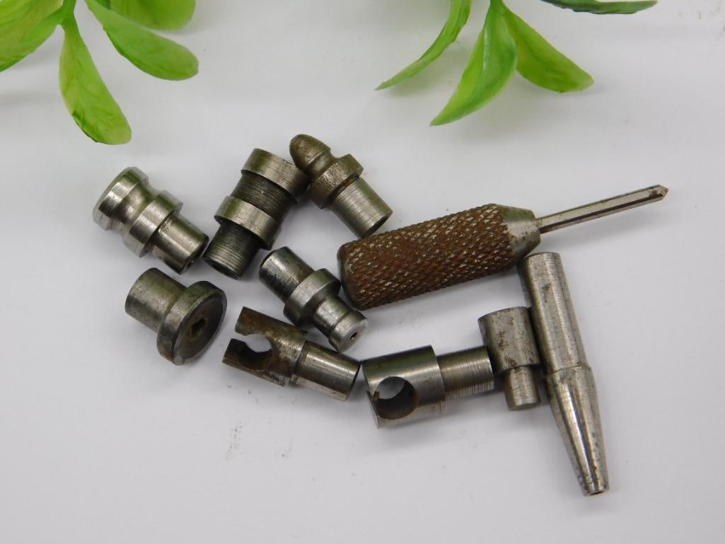 Vintage Watchmaker Staking Tool with Knurled Handle: Lot of small steel machined parts including a knurled-grip handle with a pointed rod tip (staking tool component) and a forked notched-end tool, plus several stepped punches with cupped and flared