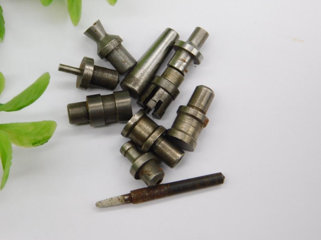 Watchmaker Staking Tool Parts with Marked Piece & Coin: Lot of small steel machined parts including a piece with a faint stamped number and a rod with a worn/taped handle end, along with stepped punches featuring cupped and pointed tips.