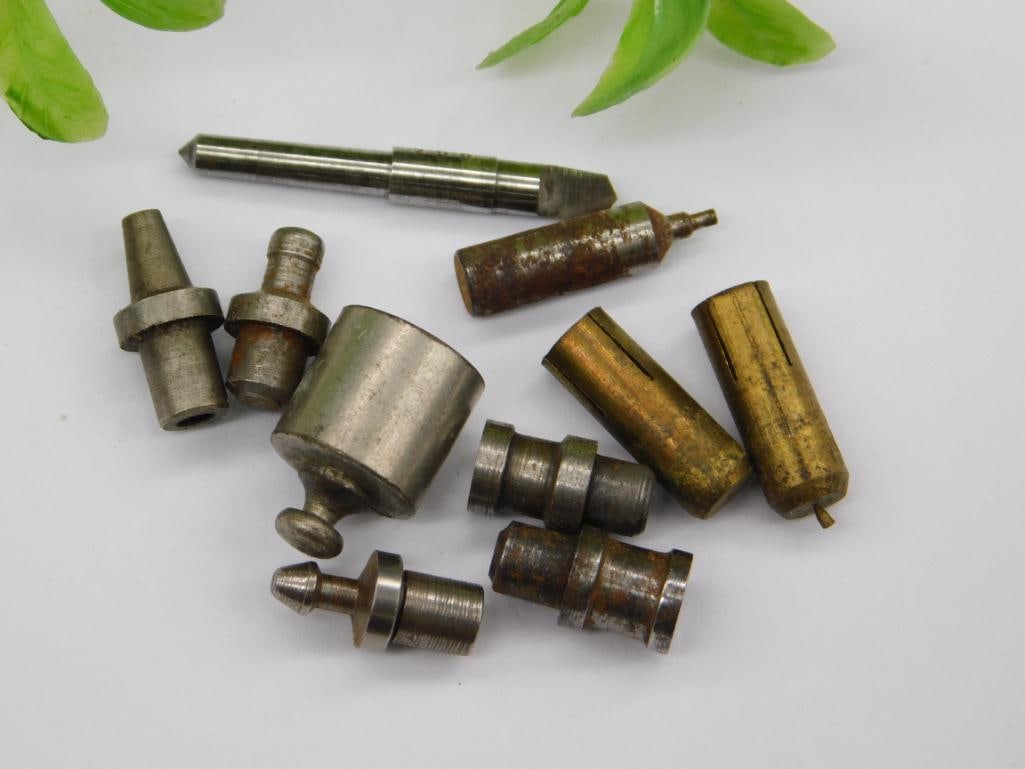 Vintage Watchmaker Staking Tool Parts Lot: Assortment of small steel machined parts including a pointed screwdriver-style bit and forked/notched-tip punches on stepped shafts, likely watchmaker staking tool components. See photos for exact