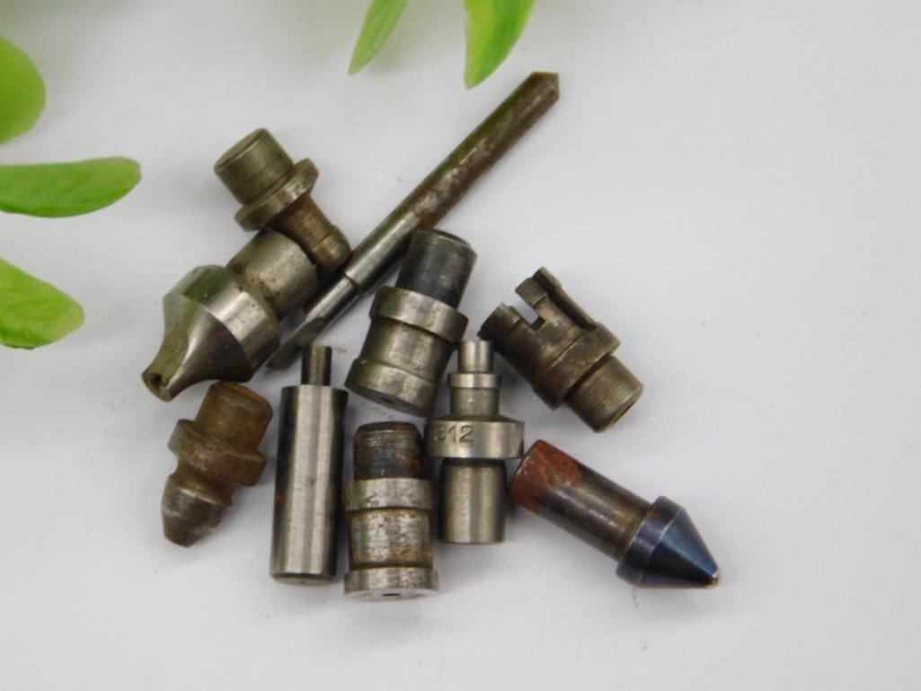 Watchmaker Tool Parts with Brass Knurled Cylinders: Lot of small steel and brass machined parts, including two knurled brass cylindrical fittings and a blued-tip pointed rod, plus stepped punches with cupped or flared tips. Some rust/patina present.
