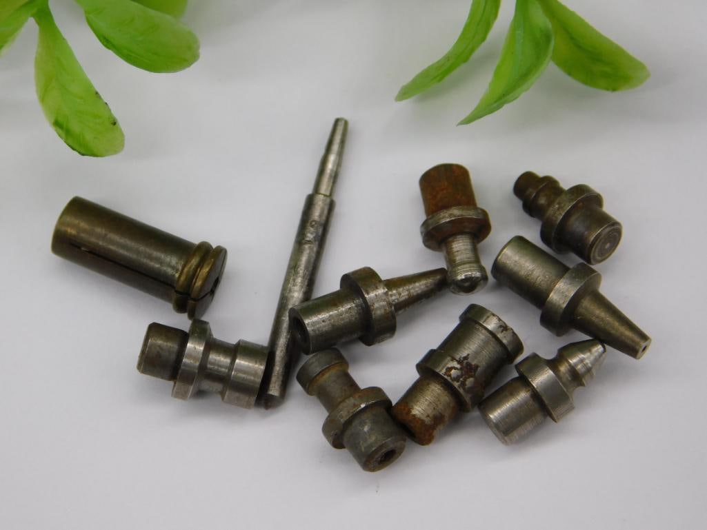 Vintage Watchmaker Tool Parts with Brass Fitting: Lot of small steel and brass machined parts, including a brass cylindrical fitting and a numbered slender rod, plus several stepped punches with pointed, cupped, and flared tips. See photos for exact