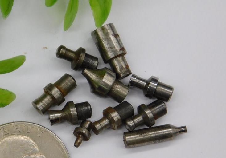 Watchmaker Lathe Stake & Punch Lot, ~11 Pieces: Assorted small steel stepped stakes and punches used for watch case and movement work, some with a pointed or conical tip. See photos for exact size and condition.