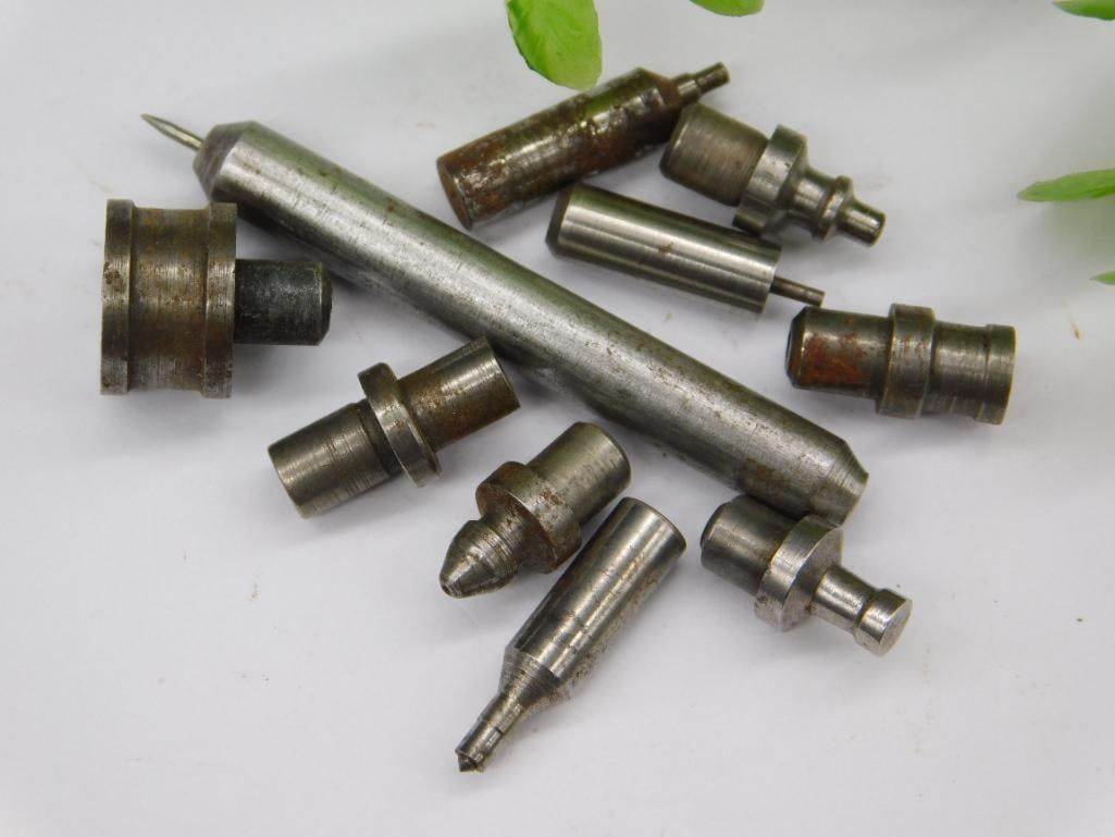Watchmaker Tool Parts, Long Pin & Stepped Stakes: Assortment of small steel stepped stakes/punches paired with a long pointed pin punch, consistent with watchmaker lathe or staking tool accessories. See photos for exact size and condition.