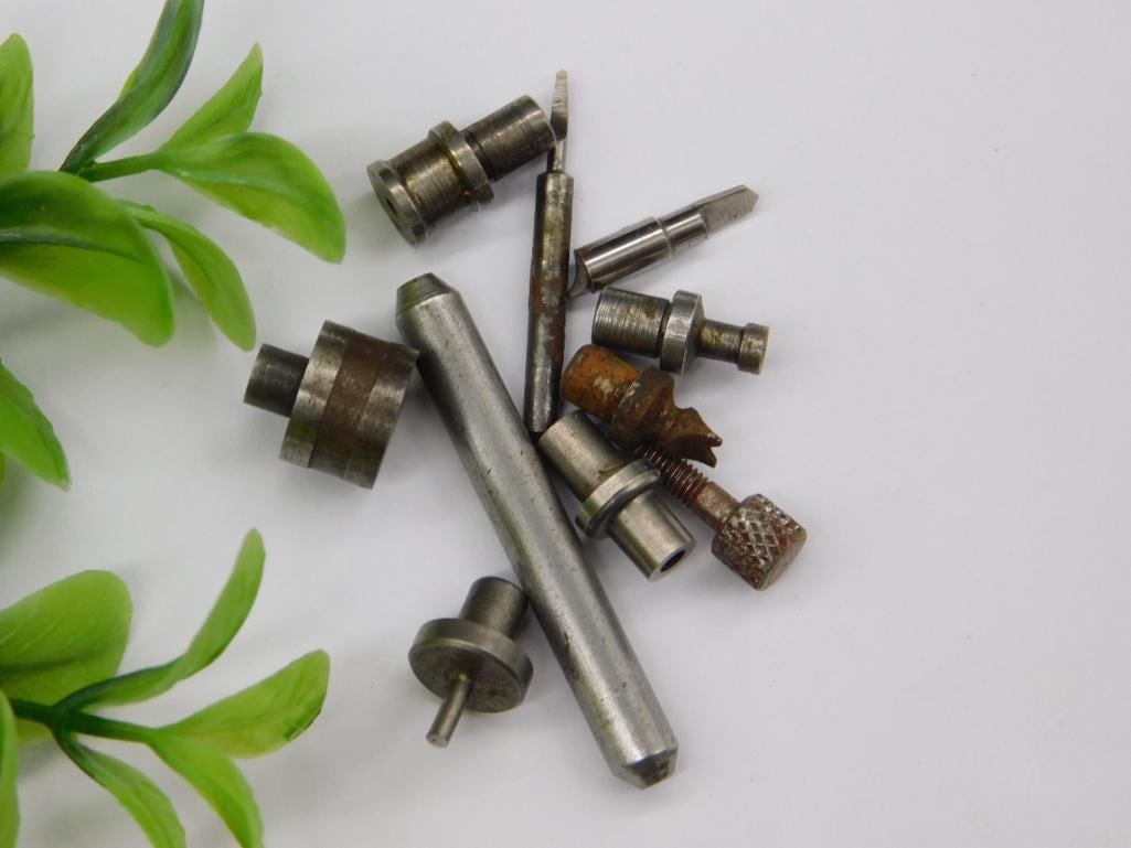 Watchmaker Punches, Slotted Tool Bit & Stakes: Assortment of small steel stepped stakes/punches with a slotted flat screwdriver-style tip and stepped collets, typical watchmaker lathe/staking tool components. See photos for exact size and