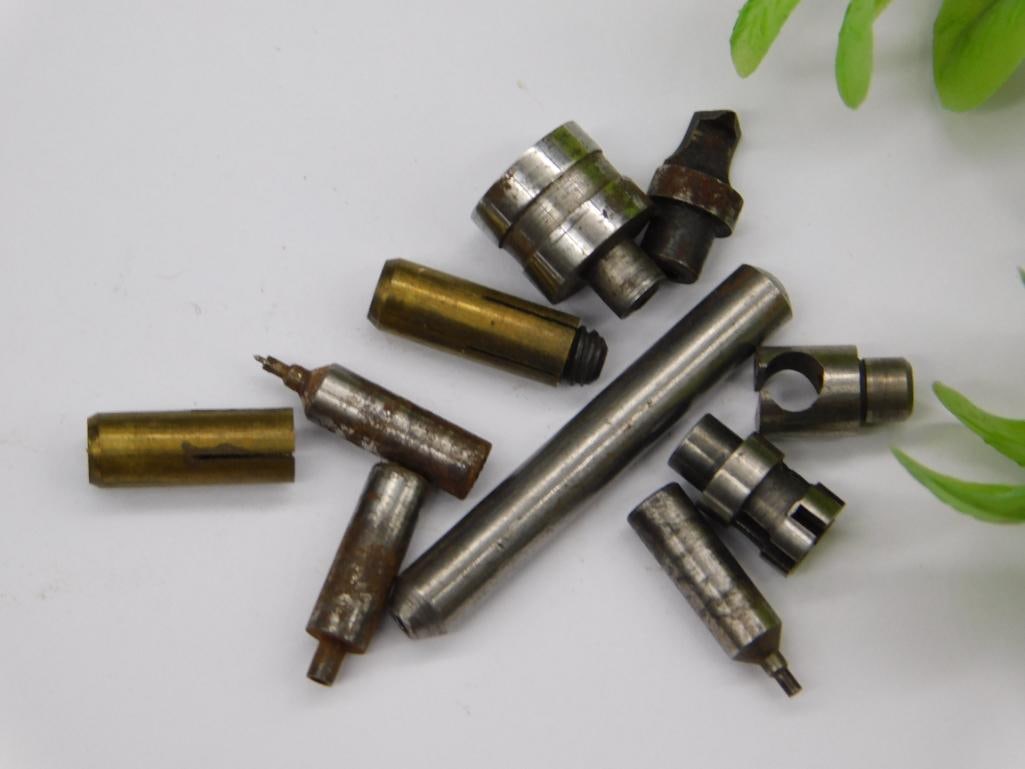 Watchmaker Lathe Parts, Brass Collets & Steel Stakes: Assortment of small steel stepped stakes/punches and slotted brass collets, one showing a fine pin tip, consistent with a watchmaker's lathe tool set. See photos for exact size and condition.