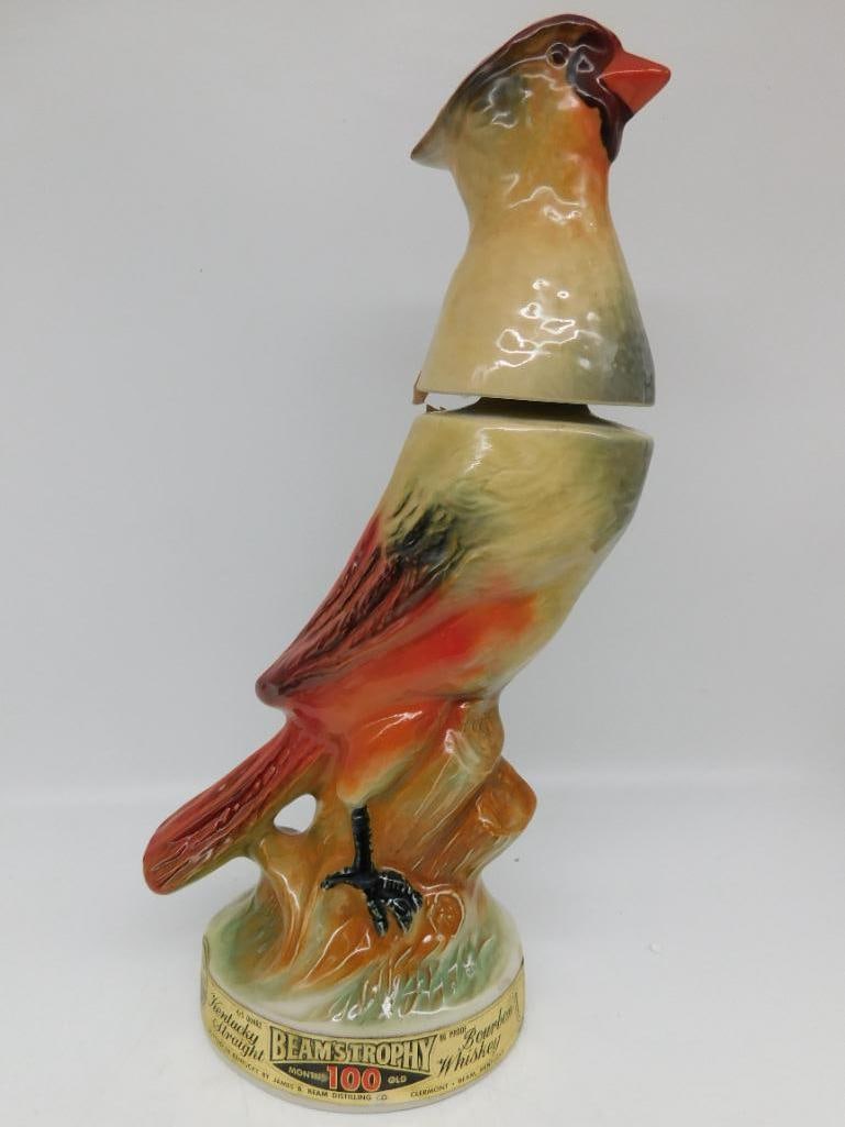 Jim Beam Beam's Trophy Cardinal Bird Ceramic Decanter: A Jim Beam Regal China decanter from the Beam's Trophy series modeled as a male cardinal perched upon a stump. The red is bright and the modeling crisp about the crest. Approximately 11.5 inches tall 