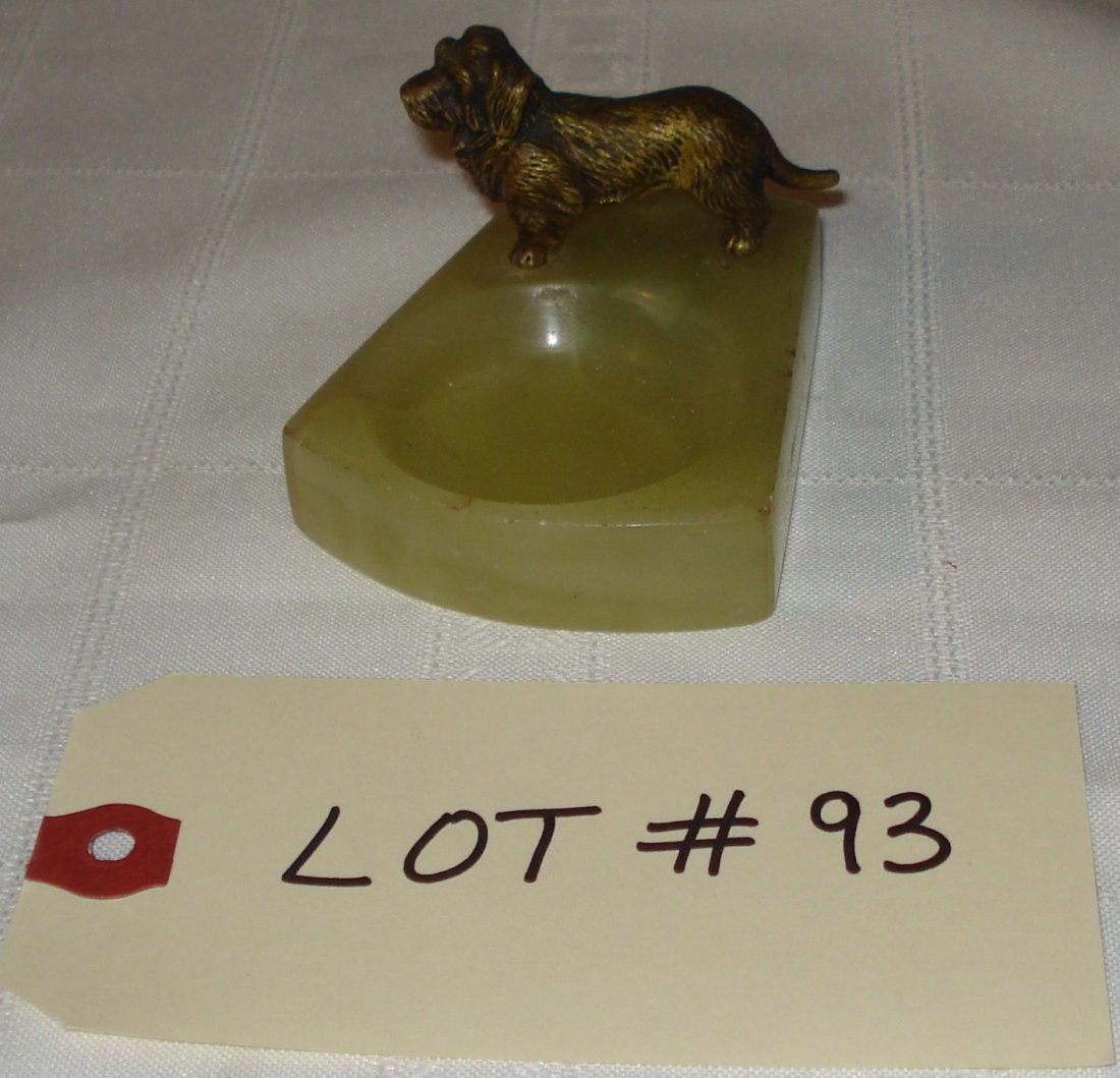 bronze dog: vintage bronze dog on base (Vienna circa 1920). 3 x 2 1/2 inches (7.5 x 6.5cm). height:2 inches (5cm). 2 pin holes on bottom (probably mounted on another piece).