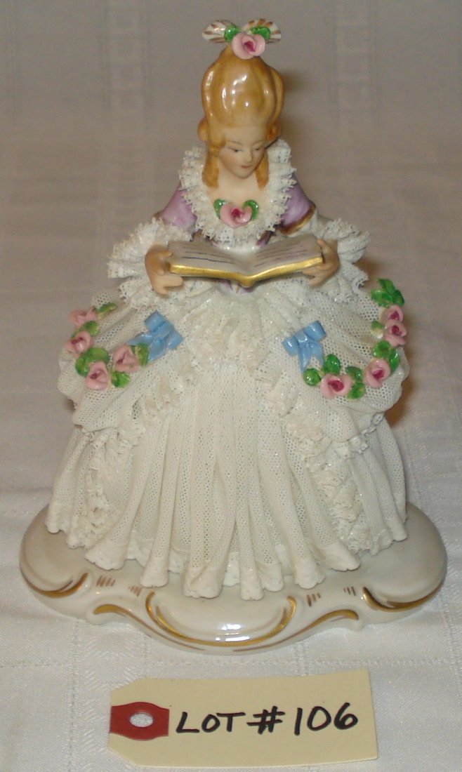 porcelain figurine: vintage porcelain figurine on pedestal (signed Dresden Germany). lady reading. height:7 inches (18cm)