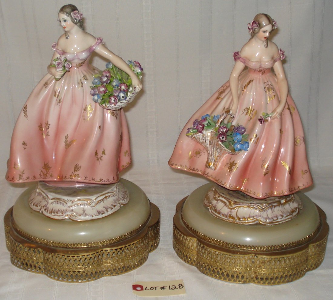 2 porcelain figurines: 2 vintage porcelain figurines representing 2 girls holding a flower basket. height:13 1/2 inches (34.5cm). combined weight:7.780kg. have switches but not tested.