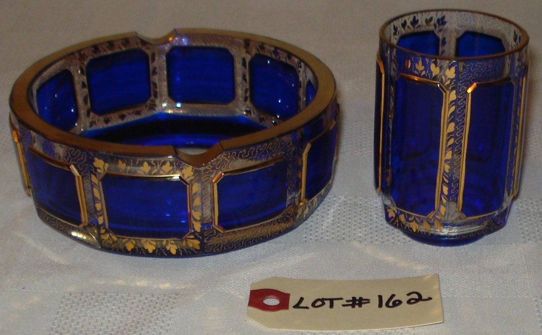 ashtray & cigarette holder: blue & gold ashtray and cigarette holder. ashtray - diameter:5 inches (13cm). height:2 inches (5cm). cigarette holder - height:3 1/4 inches (8cm). diameter:2 inches (5cm). combined weight:0.735kg