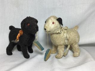 Wind Up Toys-Dogs Recieving Slippers These are Early: These are Early Windups w/ Glass Eyes. The White Dog still Works, each is 5" tall