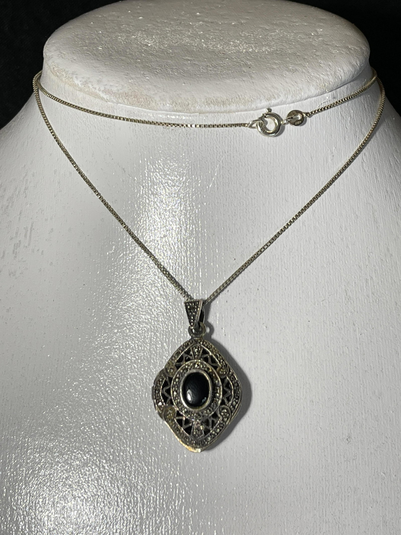 Black Onyx Stone on Sterling Locket Surrounded by: Surrounded by marcasites