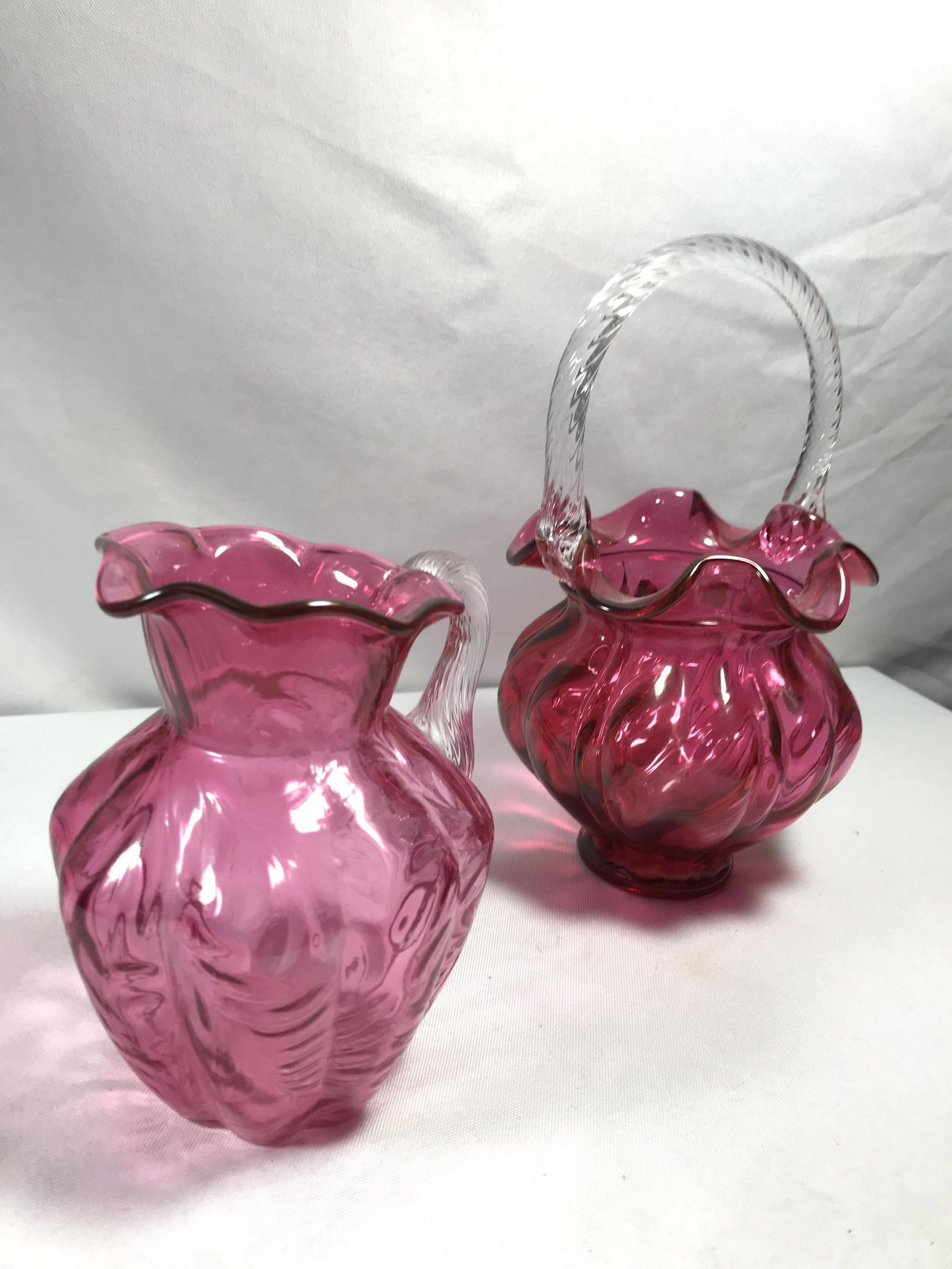 Cranberry Art Glass w Ribbon Handles approx 5 in w/o: approx 5 in w/o handle