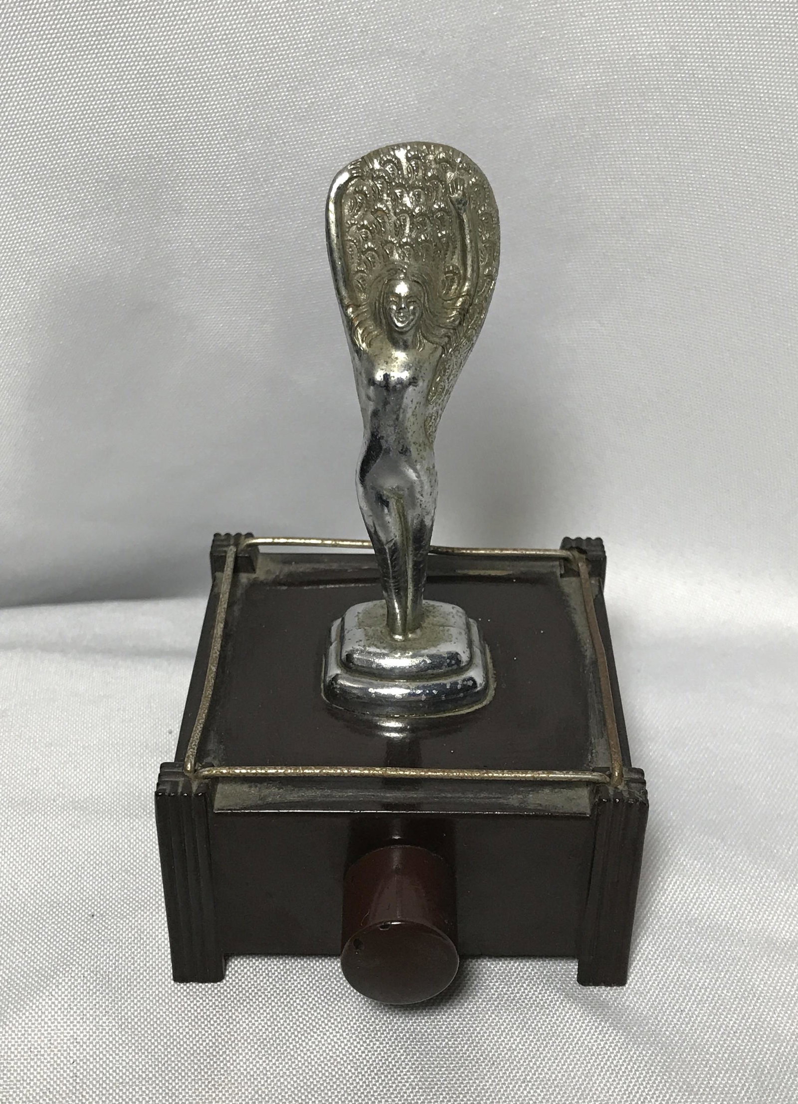 Silent Flame Table Lighter by Parker of London Bakelite: Bakelite and runs on 2 AA batteries Measures 5 inches tall by 3 inches square at base