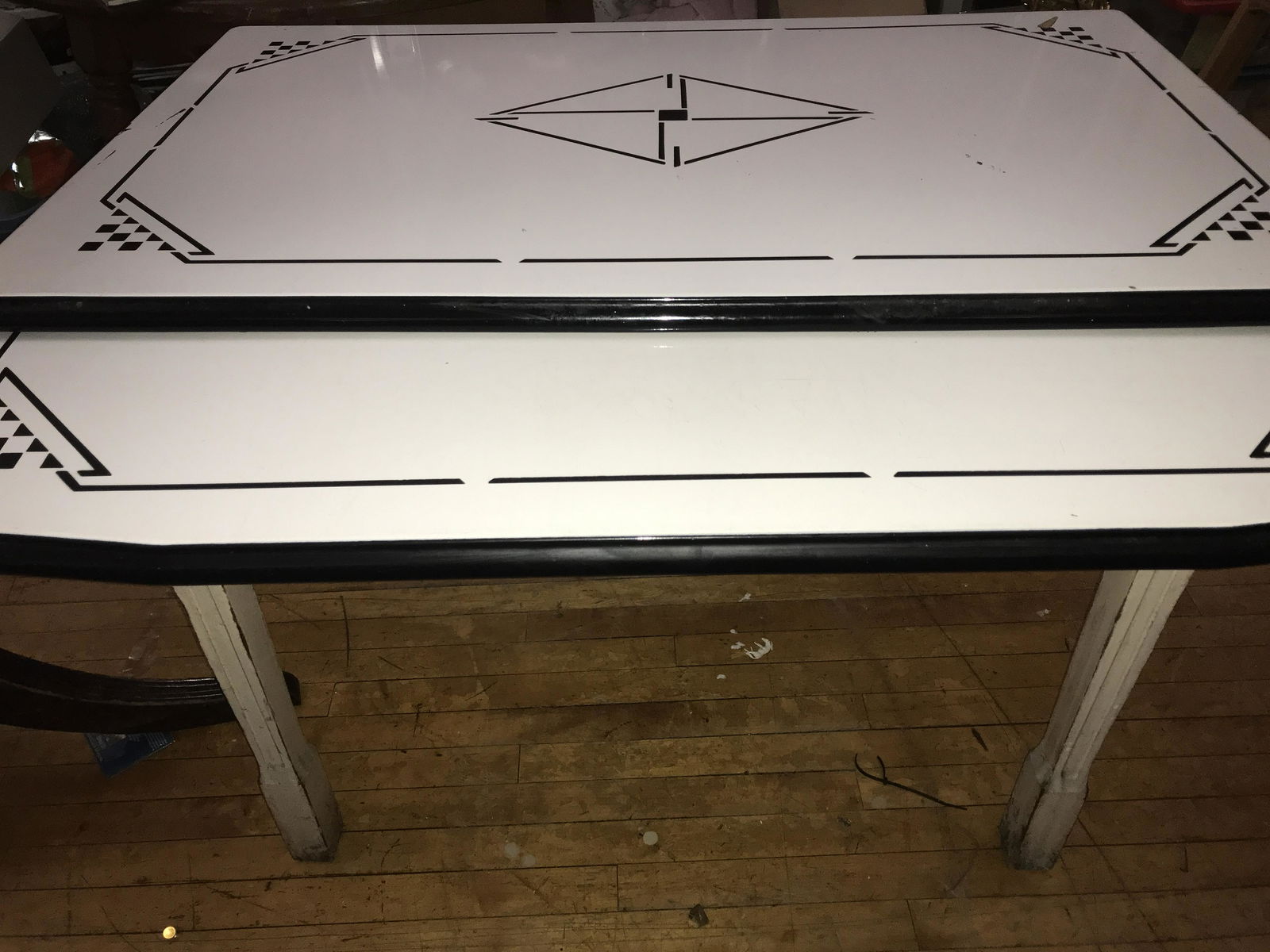 Deco Geometric Porcelain Top Table Measures 32 inches tall by 40 by 25 inches (1 of 9)