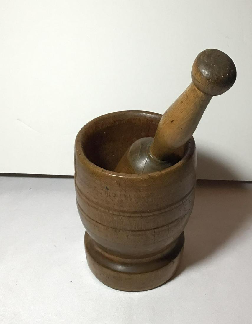 Primitive mortar and pestle . (1 of 3)