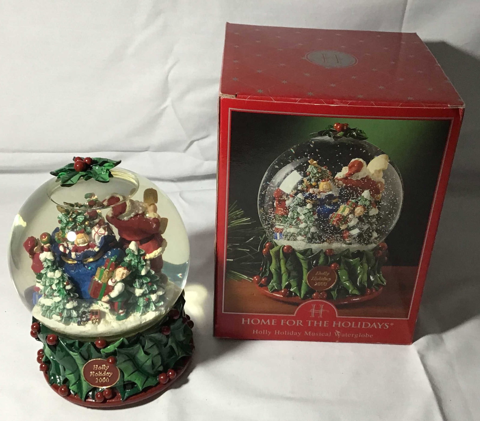 Home for the Holidays Christmas Globe with Santa: new in box measurements 8 1/2" x 5 1/2"