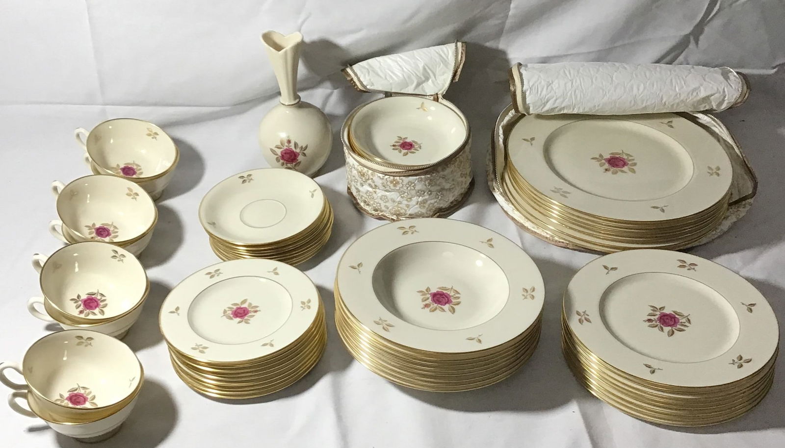 Lenox Rhodora Pattern Bone China Set (59 pcs): Includes Tea cups,saucers,dessert plate, vase, fruit bowl, entrÃ©e plate, dinner plate, and veggie bowl. With two vinyl pouches for fruit, bowls, and dinner plates