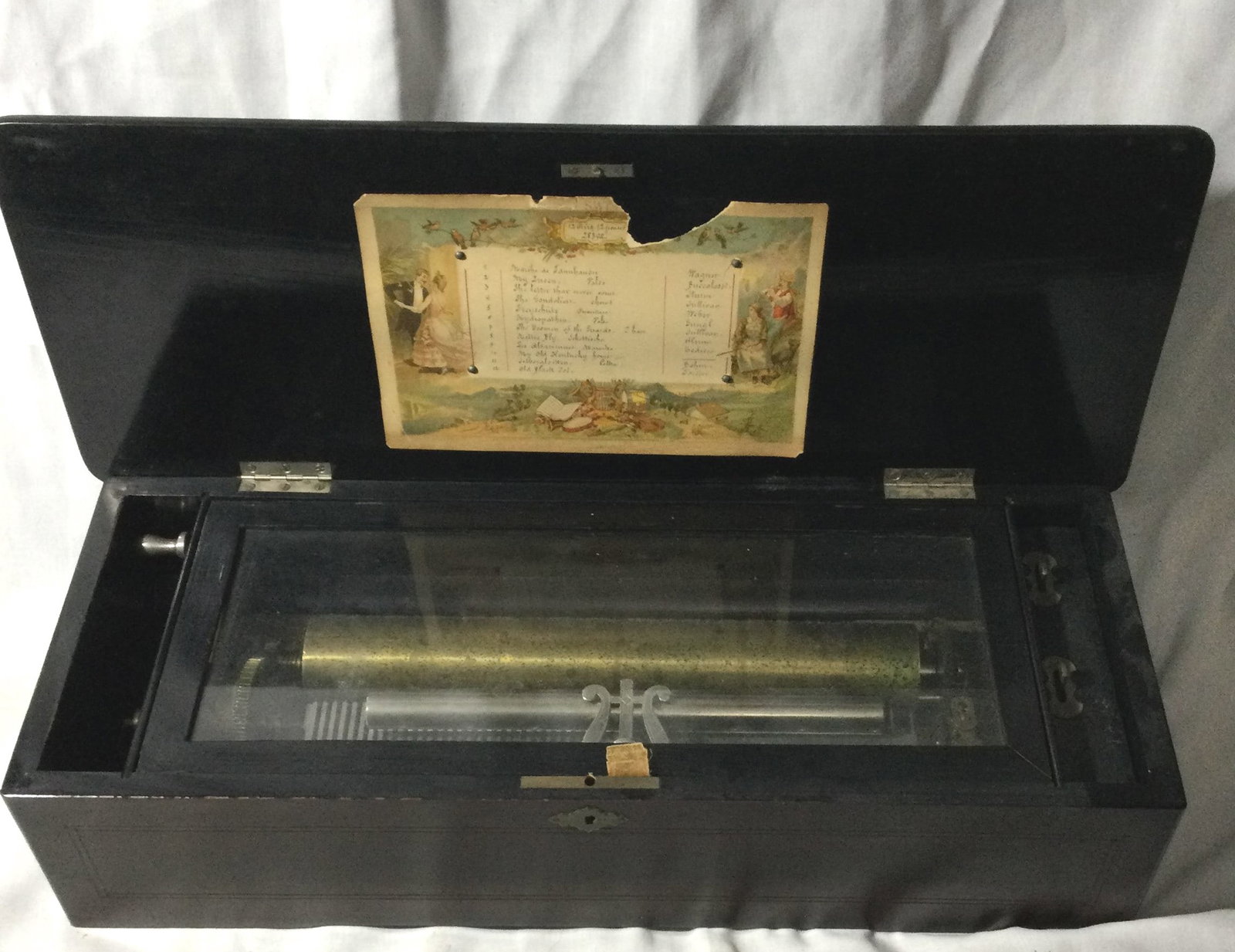Swiss Cylinder Music Box - 12 Songs: Is In great playing condition, measures 8 inches deep by 6 inches tall and 22 inches long.
