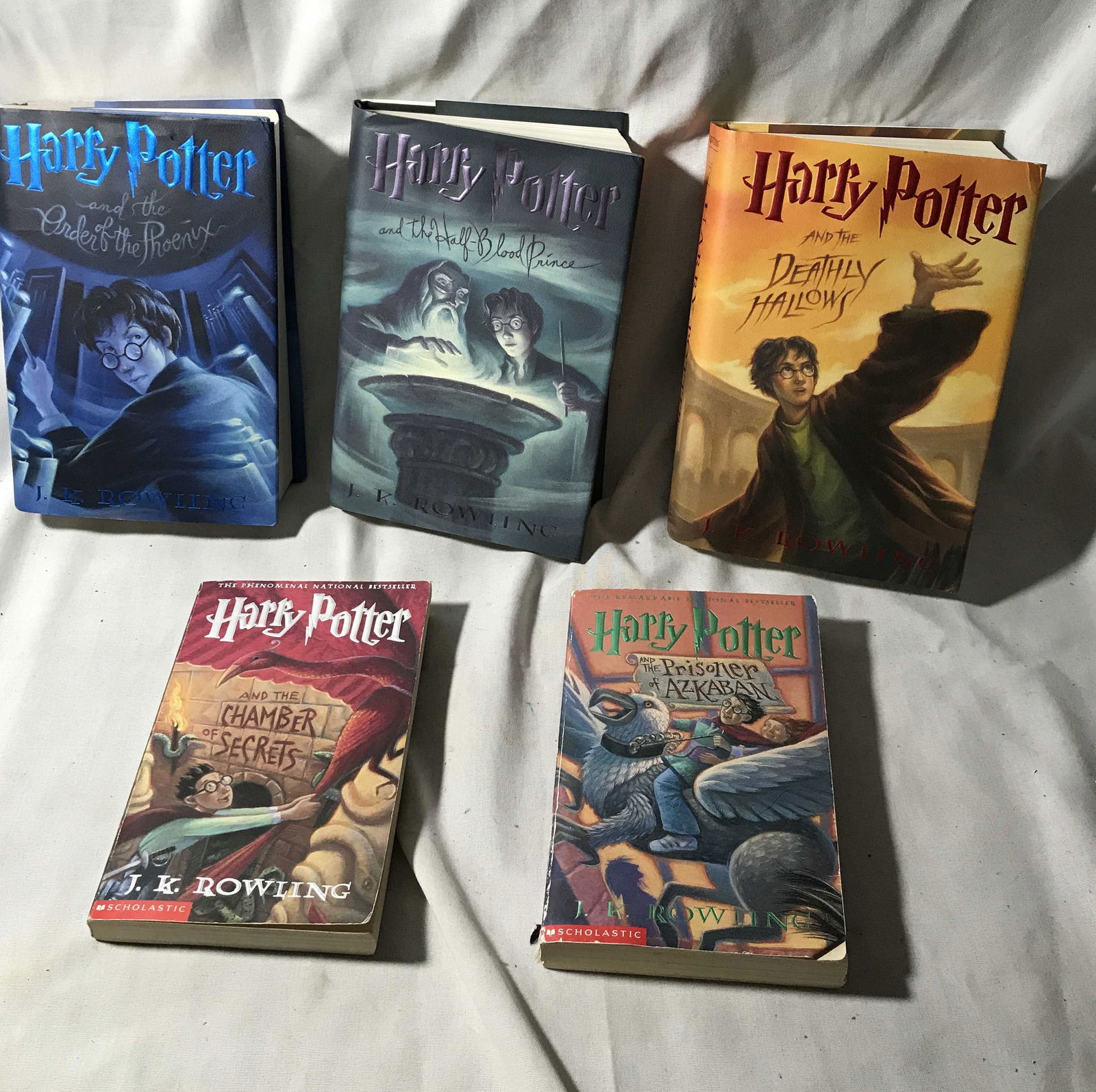 Harry Potter Book Collection: 3 hard cover to paperback. Titles include order of the Phoenix, the half blood prince, deathly hallows chamber of secrets and prisoner of a ZKABAN good condition