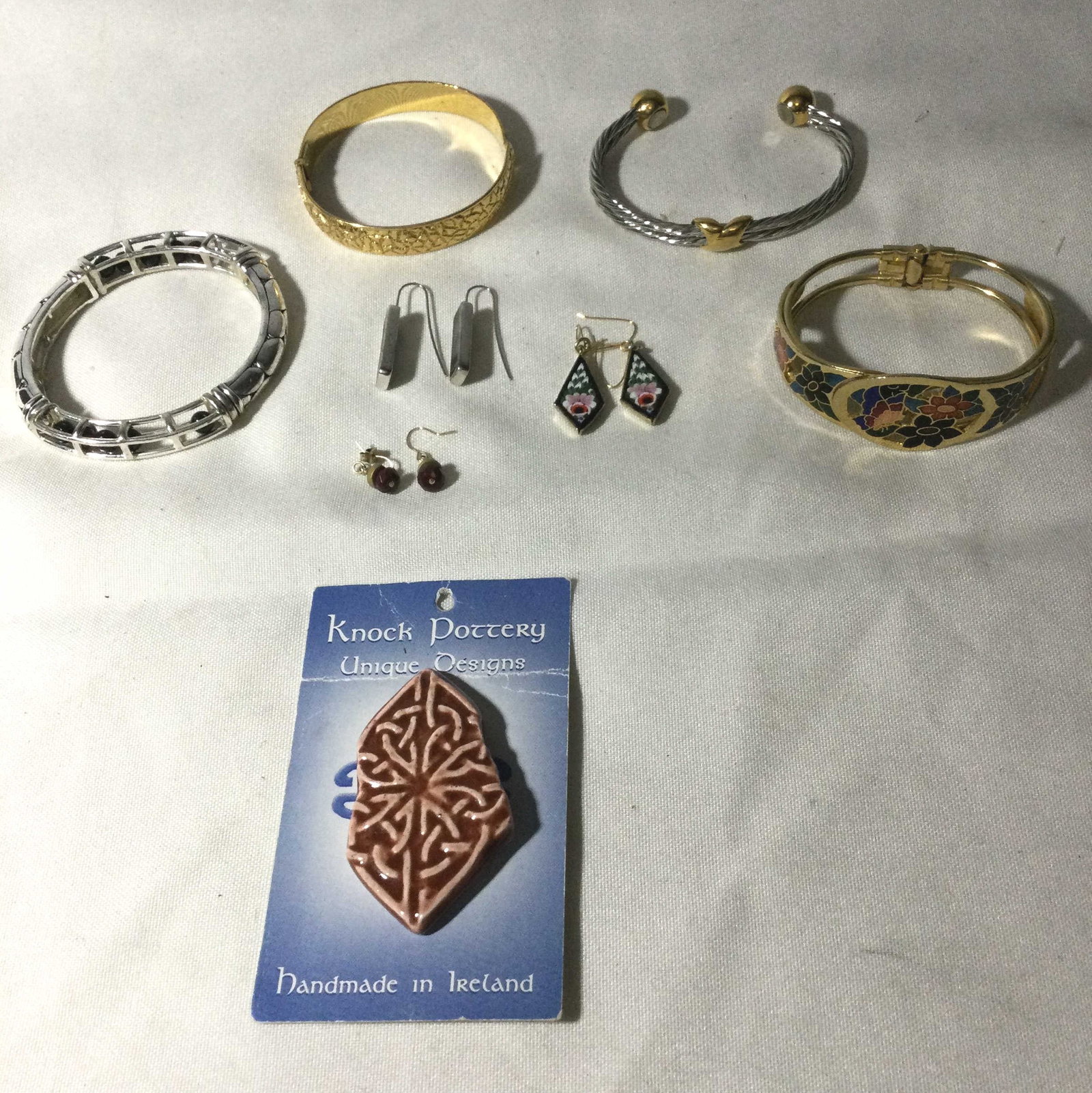 Cotume Jewelry Collection: four bracelets three set earrings and one handmade in Ireland knock pottery design