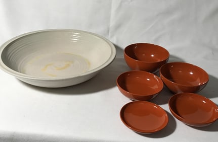 Five small nesting, bowls, and one pottery