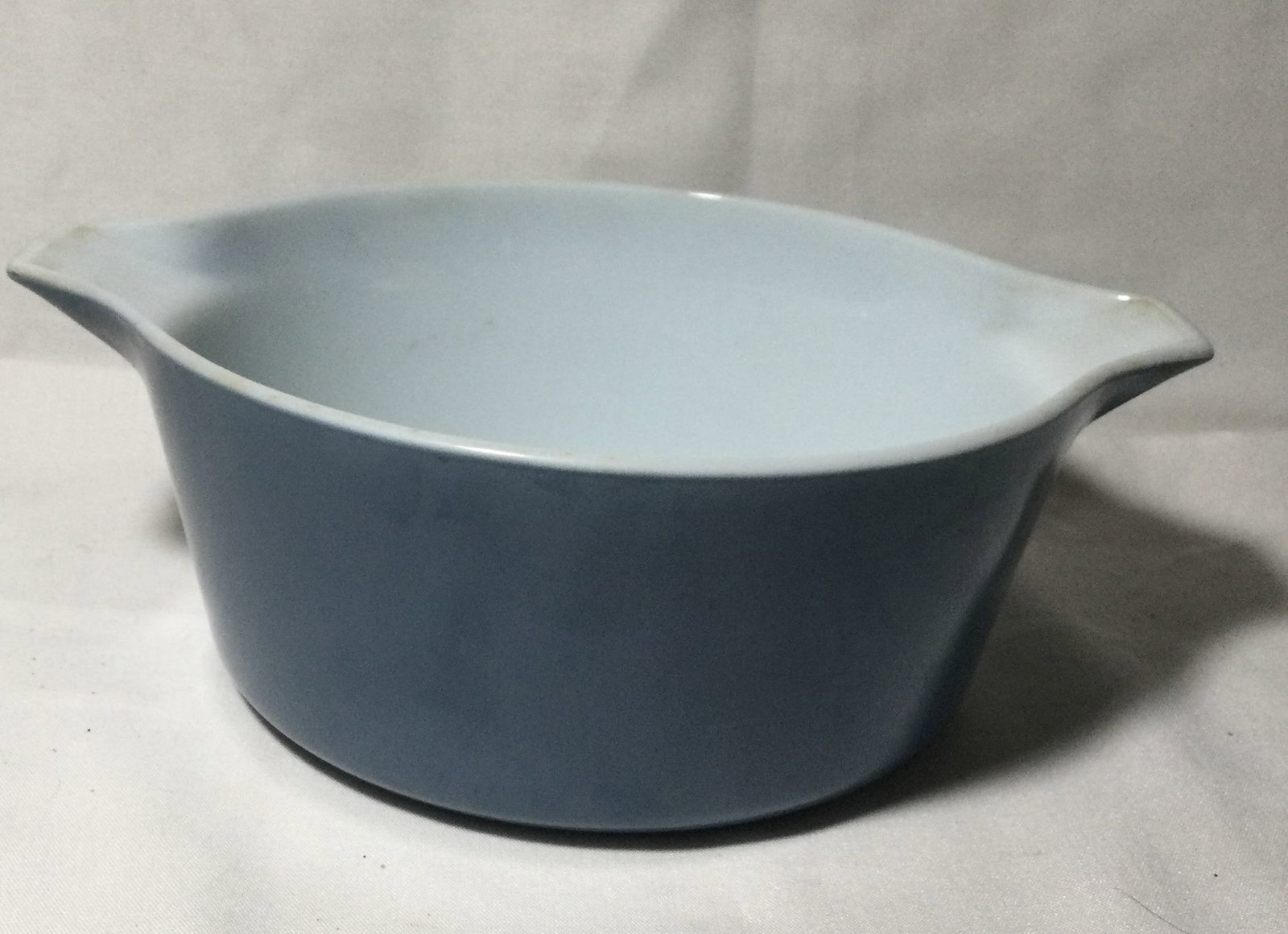 Large Pyrex Bowl with Handles: measures 8 1/2 inches across and three and three-quarter inch deep