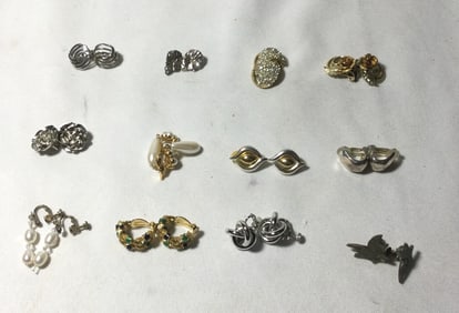 12 pair of earrings which are all clip on