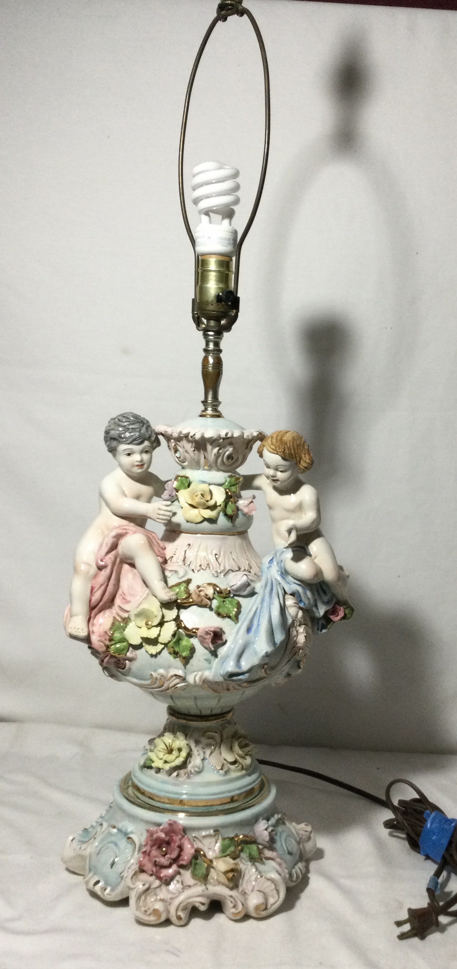 Capodimonte-style Italian Porcelain Lamp - Works!: Featuring cherubs and floral designs measures 36 to the very top 11 inches wide in the center 9 inches wide at the bottom, no shade. No In-House Shipping, can be shipped from UPS. Buyer will be dealin