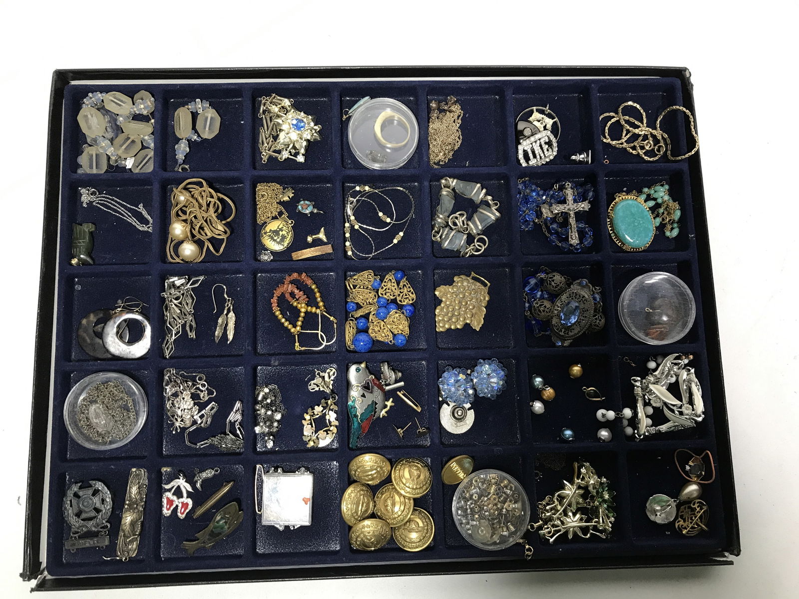 Costume Jewelry: Random, not everything has a pair, some buttons, a rosary, necklace, charms, earrings etc