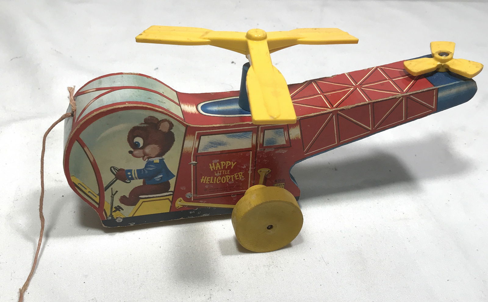 Fisher Price Happy w/ Helicopter Pull Toy: Wooden w/ Litho, works, measures L: 9 inches H: 3.5 inches W: 1.5 inches