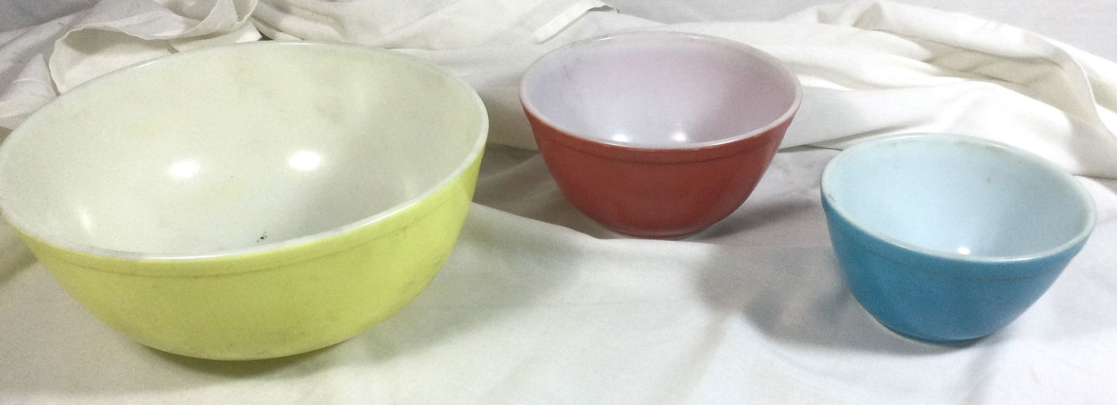 Pyrex Bowls (3): Blue bowl 5.5 inches wide by 3.5 inches tall, Red bowl 7 inches wide by 4 inches tall, Yellow bowl 10 inches wide by 4.5 inches tall