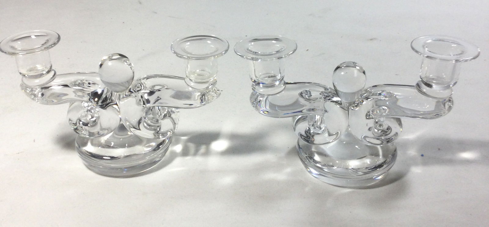 Steuben Double Scroll Candle Holders (pair): signature on bottom measure 4 1/2 inches high by 7 3/4 inches wide