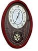 WallarGe Contemporary Oval Musical Motion Quartz Wall Clock: A contemporary oval-shaped quartz wall clock by WallarGe featuring a cherry-finish composite frame and a glass face. The dial displays a white oval center with stylized brown Arabic numerals, ornate