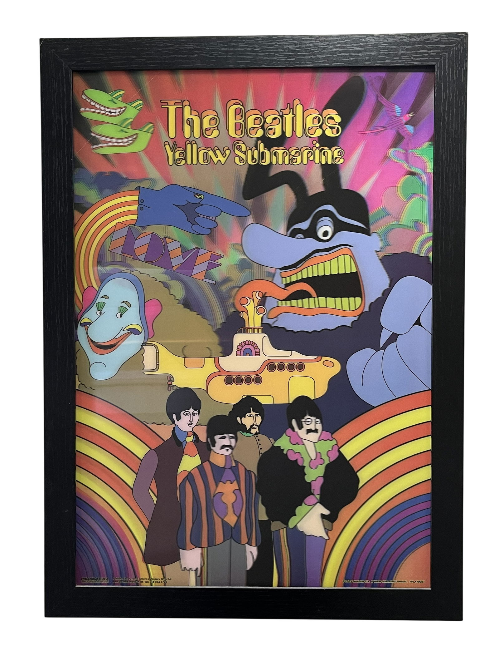 THE BEATLES "YELLOW SUBMARINE" FRAMED 3D LENTICULAR POSTER, PYRAMID AMERICA: This lot features a vibrantly colored 3D lenticular poster celebrating the 1968 animated masterpiece *Yellow Submarine*. Produced in 2009 by Pyramid America, this licensed collectible utilizes a