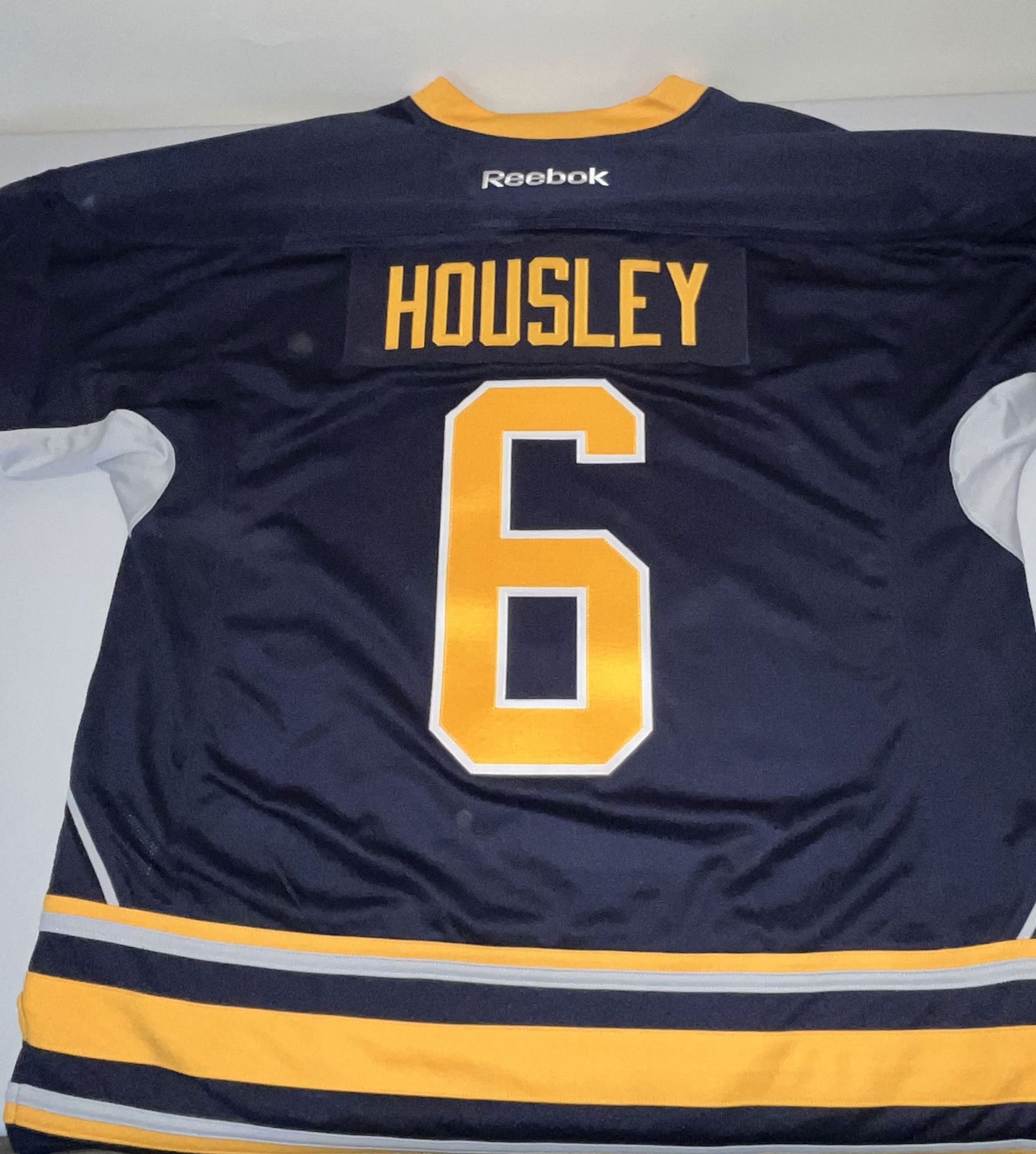 Phil Housley Buffalo Sabres Reebok Premier Jersey, New with Tags Size XL: This is an official Reebok Premier licensed jersey for the Buffalo Sabres, featuring the name and number of Hockey Hall of Fame defenseman Phil Housley. Housley is a franchise legend who played for th